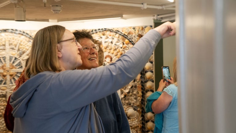 Visitors exploring the Room of Discovery
